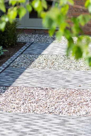 Pathway using Silver Grey Multi Clay Pavers with planted borders, light gravel inserts between clay paver areas.